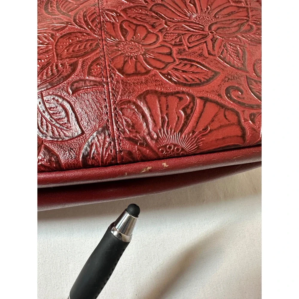 Gun Tote'n Mamas Burgundy Floral Embossed Leather Concealed Carry Crossbody Bag
